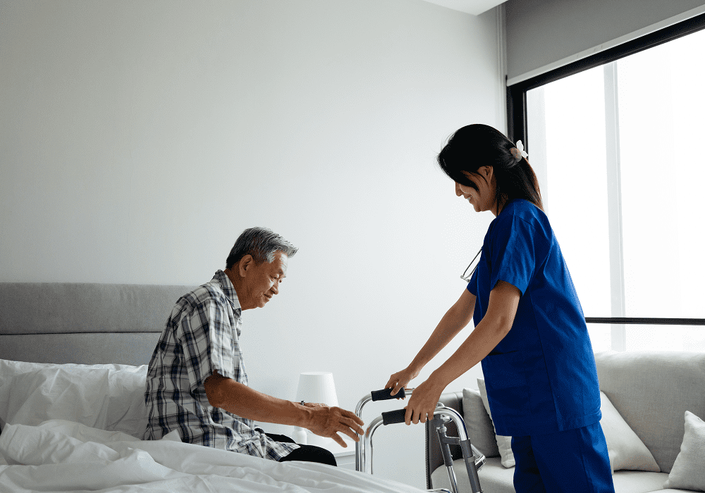 Elderly man assisted by healthcare worker